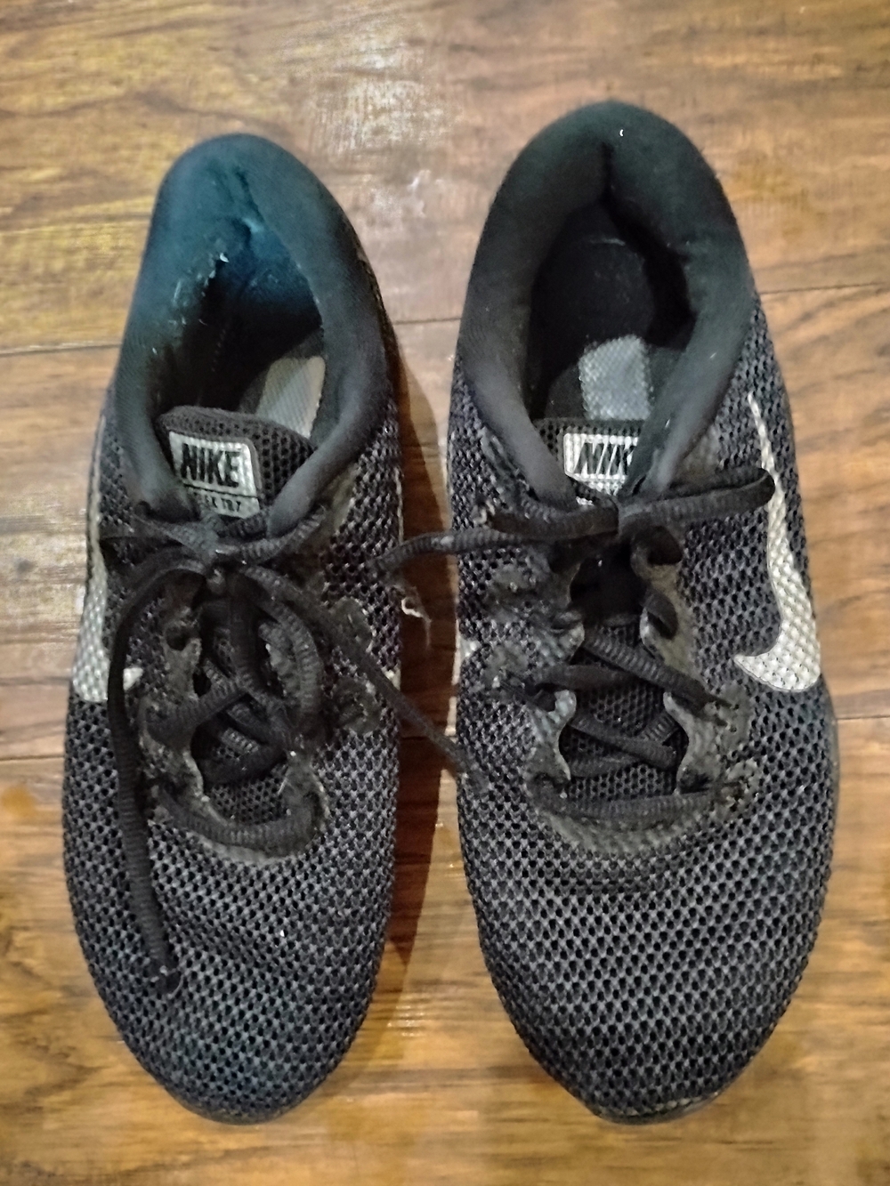 Nike Women’s Black Mesh Athletic Sneakers with White Swoosh